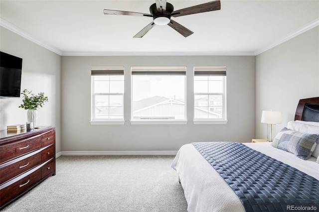 bedroom with carpet floors, baseboards, crown molding, and multiple windows