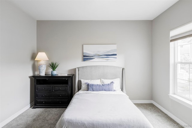 carpeted bedroom with baseboards