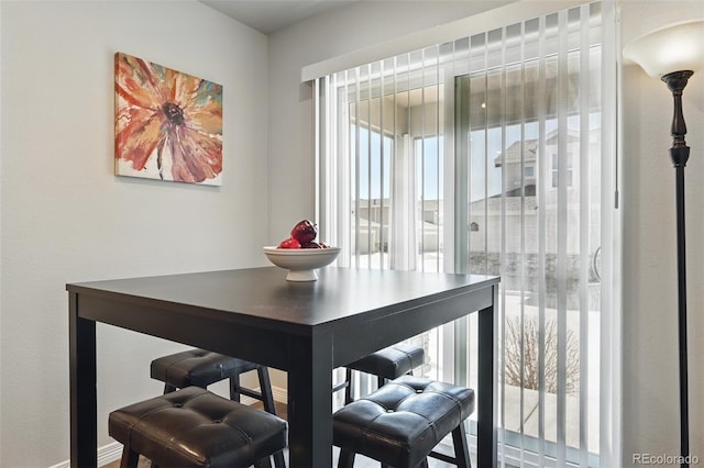 dining space featuring baseboards