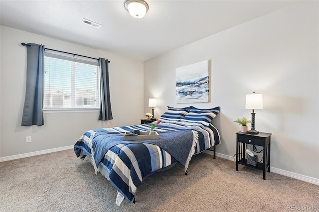 bedroom featuring light carpet, visible vents, and baseboards
