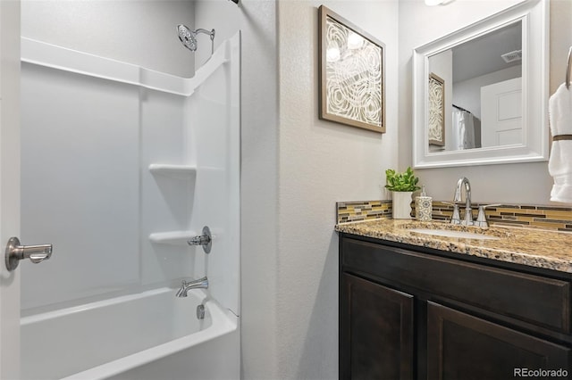 bathroom with shower / tub combo and vanity