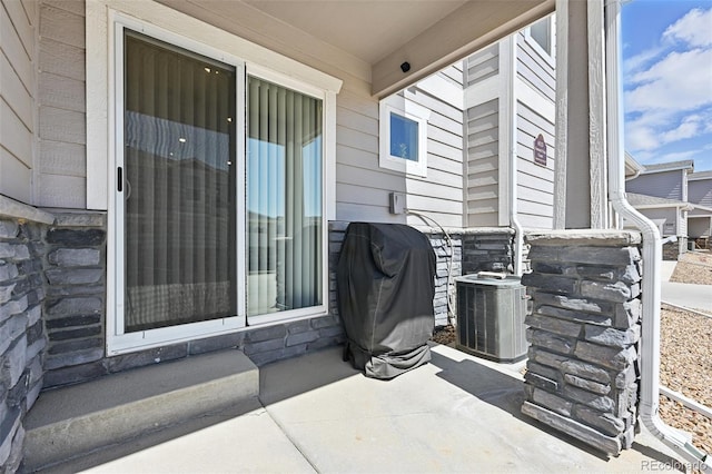 view of patio with central AC unit and grilling area