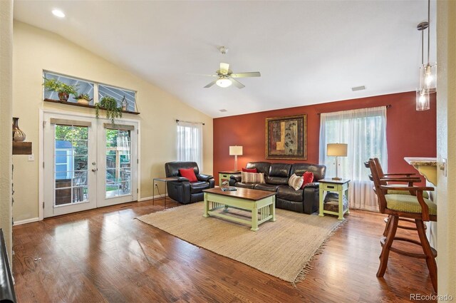 6480 Moss Cir, Arvada, CO 80007 - living room featuring vaulted ceiling, a ceiling fan, wood finished floors, and french doors