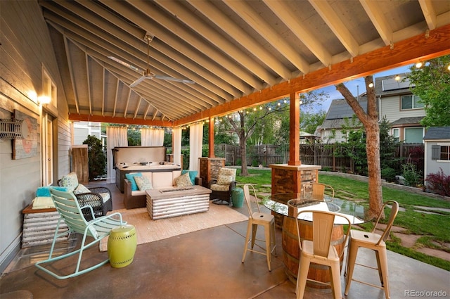 6480 Moss Cir, Arvada, CO 80007 - fenced backyard featuring a patio, outdoor lounge area, an outdoor kitchen, and outdoor dining space