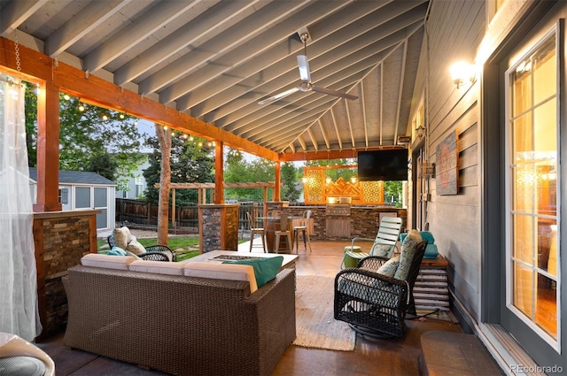 6480 Moss Cir, Arvada, CO 80007 - fenced backyard featuring an outdoor living space with a fire pit, an outdoor kitchen, a shed, a patio area, and a ceiling fan