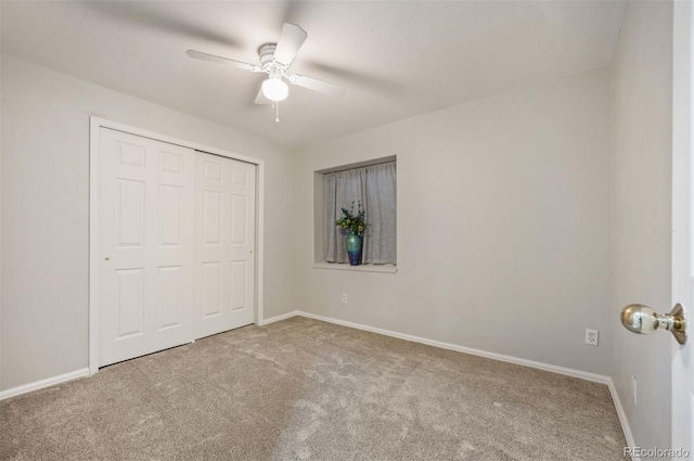 6480 Moss Cir, Arvada, CO 80007 - unfurnished bedroom with carpet flooring, a closet, and a ceiling fan