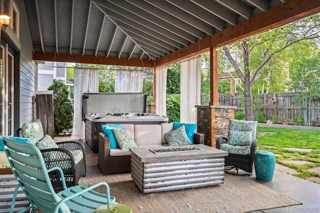 6480 Moss Cir, Arvada, CO 80007 - fenced backyard featuring a hot tub, an outdoor fire pit, and a patio area