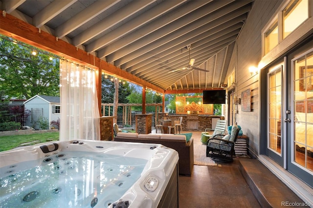 6480 Moss Cir, Arvada, CO 80007 - view of patio featuring a hot tub, ceiling fan, and an outdoor hangout area