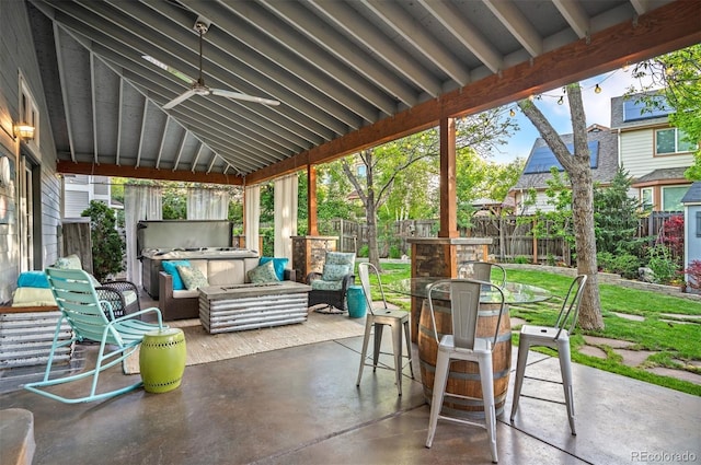 6480 Moss Cir, Arvada, CO 80007 - fenced backyard featuring a patio, an outdoor hangout area, and a ceiling fan