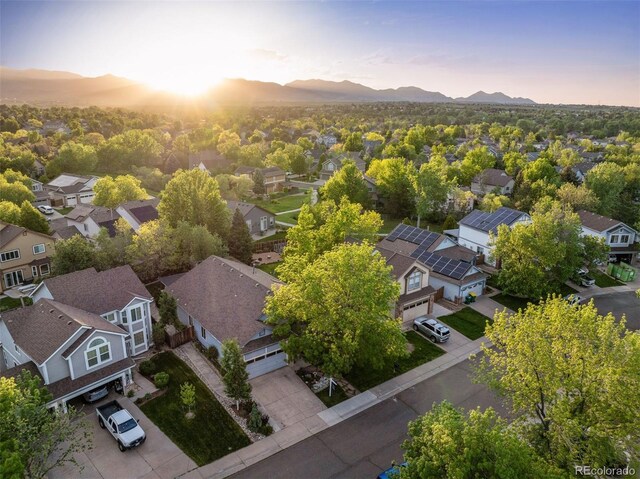 6480 Moss Cir, Arvada, CO 80007 - aerial view at dusk of a residential view and a mountain view