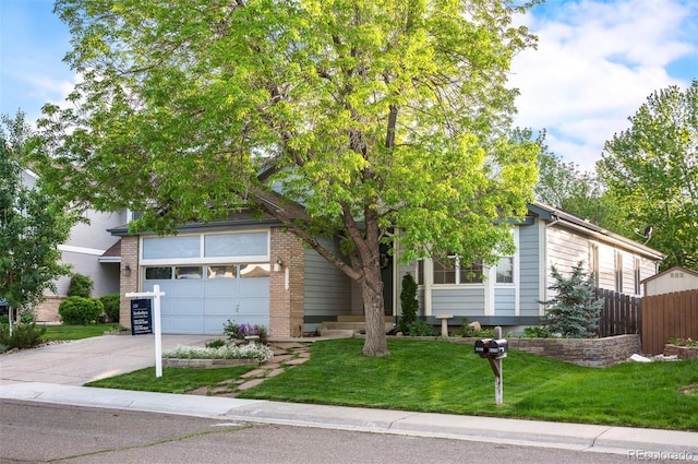 6480 Moss Cir, Arvada, CO 80007 - obstructed view of property with driveway, a garage, and brick siding