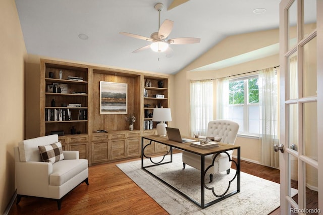 6480 Moss Cir, Arvada, CO 80007 - office area featuring vaulted ceiling, ceiling fan, and light wood-style floors