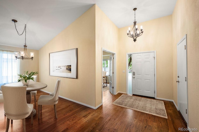 6480 Moss Cir, Arvada, CO 80007 - entrance foyer with a chandelier, healthy amount of natural light, wood finished floors, and high vaulted ceiling