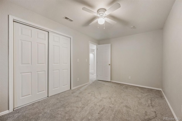 6480 Moss Cir, Arvada, CO 80007 - unfurnished bedroom featuring carpet flooring, a closet, ceiling fan, and a textured ceiling