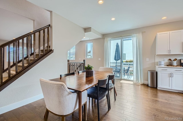 dining space featuring recessed lighting, baseboards, and light wood finished floors