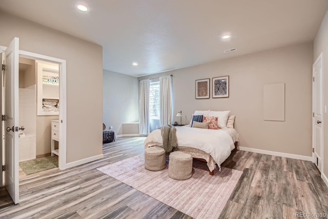 bedroom featuring recessed lighting, visible vents, baseboards, and wood finished floors