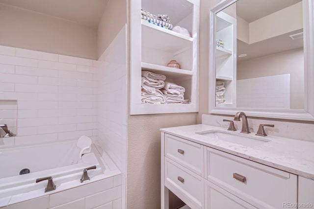 full bath featuring a washtub, visible vents, and vanity