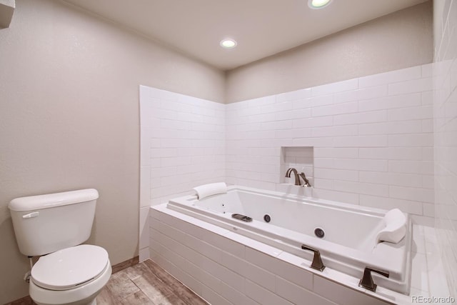 full bathroom with toilet, recessed lighting, wood finished floors, baseboards, and a whirlpool tub