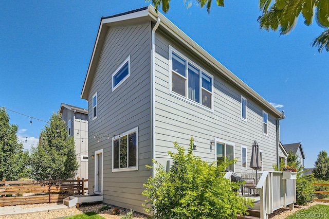 view of property exterior featuring fence