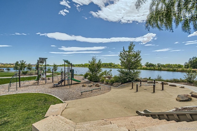 community play area featuring a water view and a yard