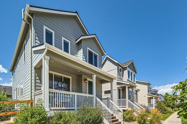 view of front of property featuring covered porch