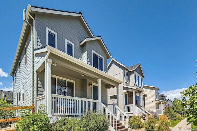 view of front facade with a porch and board and batten siding