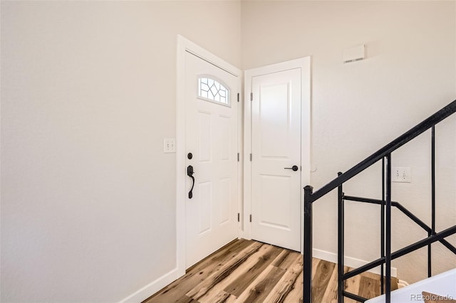 entrance foyer with light wood-type flooring and baseboards