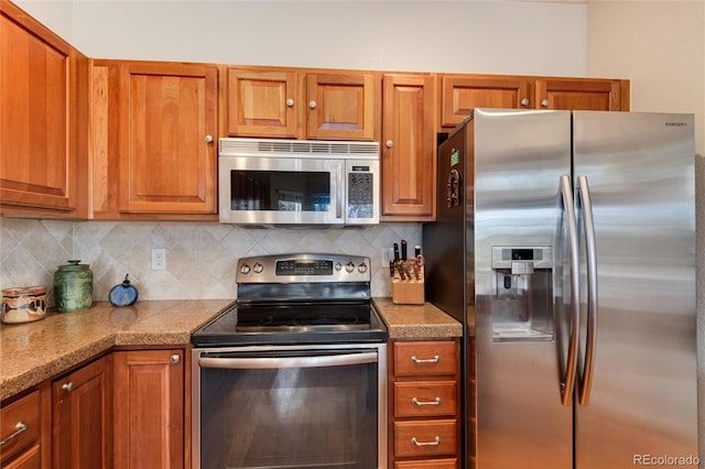 kitchen featuring decorative backsplash and stainless steel appliances