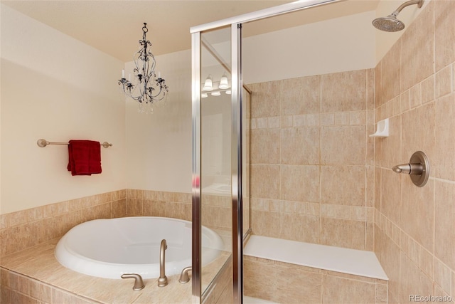 bathroom featuring shower with separate bathtub and an inviting chandelier