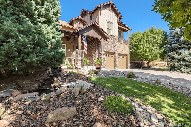 craftsman-style home featuring board and batten siding, stone siding, an attached garage, and concrete driveway