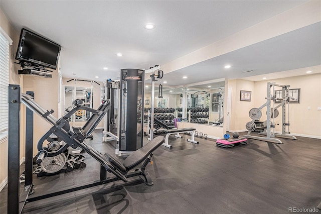 gym featuring recessed lighting and baseboards