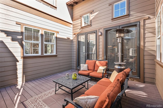 wooden deck featuring an outdoor hangout area