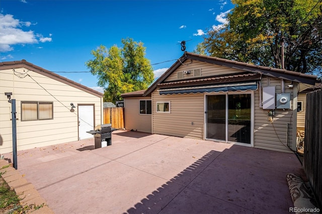 back of property featuring a patio