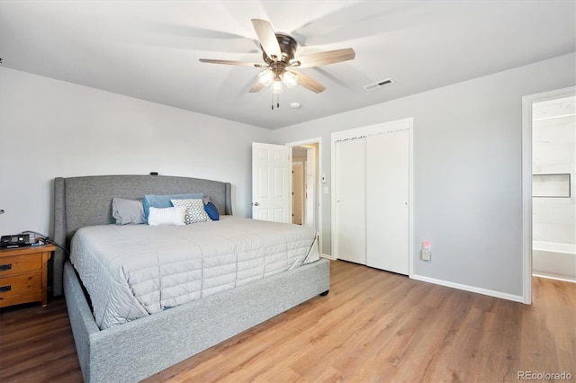 bedroom with wood-type flooring, a closet, and ceiling fan