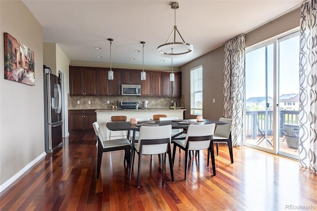 dining area featuring plenty of natural light and hardwood / wood-style floors