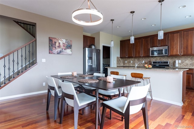 dining room with dark hardwood / wood-style floors