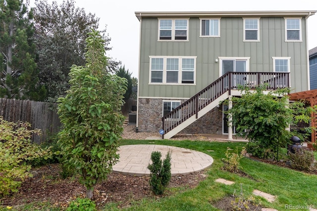 back of property with a patio