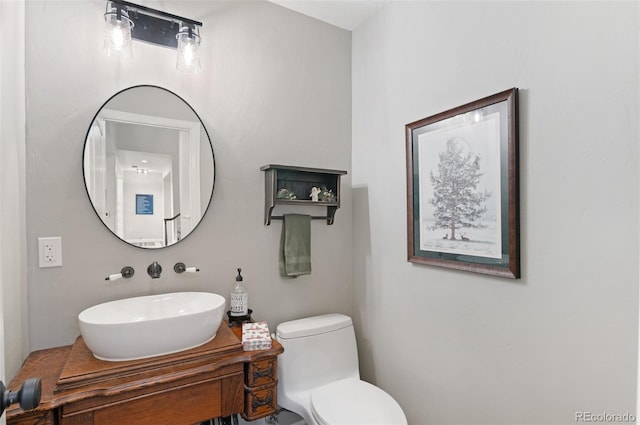 bathroom featuring vanity and toilet