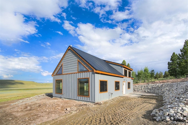 view of property exterior featuring metal roof and board and batten siding