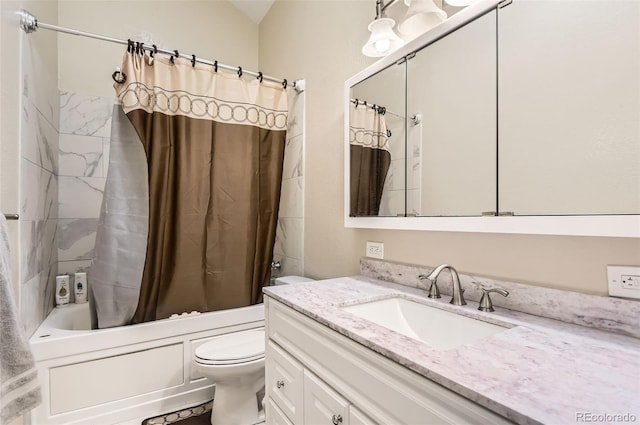 full bathroom featuring shower / bath combo, vanity, and toilet