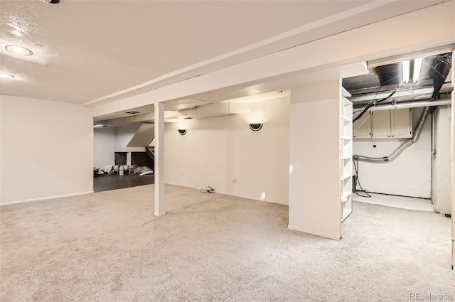 basement featuring carpet flooring