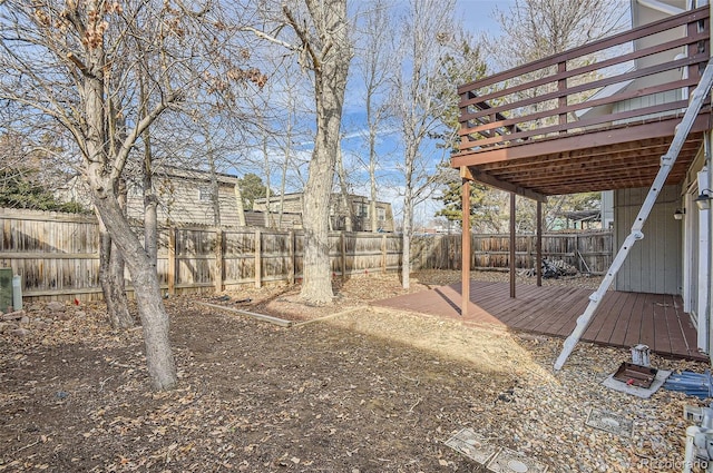 view of yard featuring a wooden deck