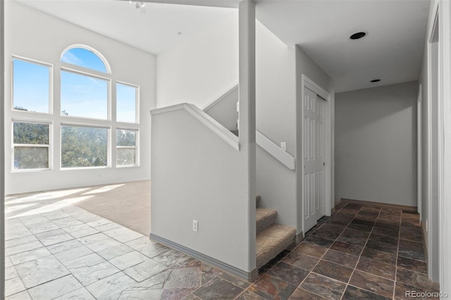6904 Sprucedale Park Way, Evergreen, CO 80439 - staircase with healthy amount of natural light and baseboards