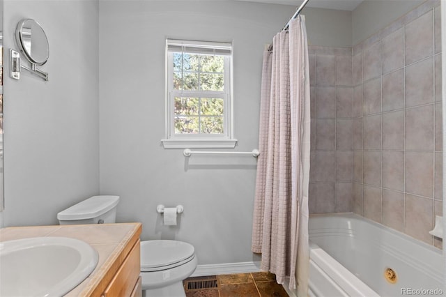 6904 Sprucedale Park Way, Evergreen, CO 80439 - full bathroom with vanity, toilet, baseboards, shower / bath combo with shower curtain, and tile patterned floors