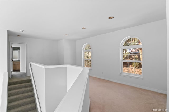 6904 Sprucedale Park Way, Evergreen, CO 80439 - hall featuring an upstairs landing, light carpet, baseboards, and recessed lighting