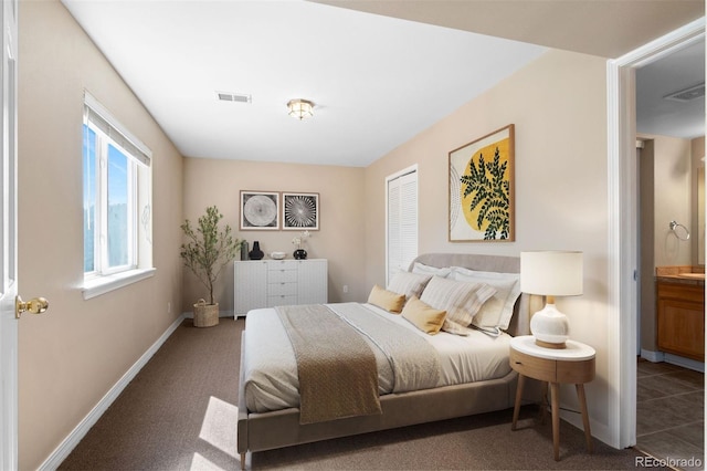 6904 Sprucedale Park Way, Evergreen, CO 80439 - carpeted bedroom featuring baseboards and a closet