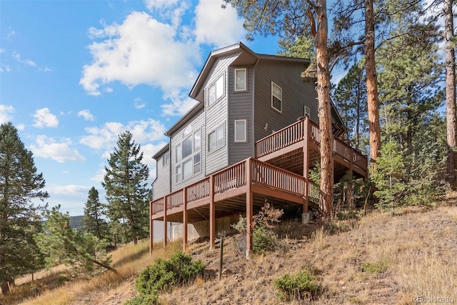 6904 Sprucedale Park Way, Evergreen, CO 80439 - back of property featuring a wooden deck