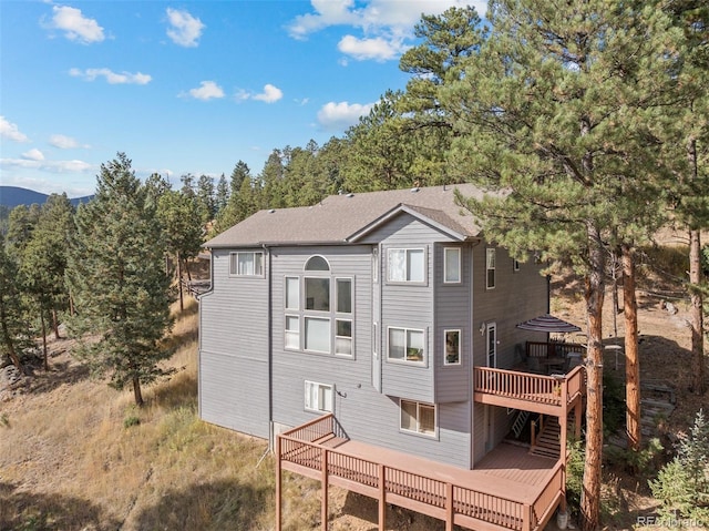 6904 Sprucedale Park Way, Evergreen, CO 80439 - rear view of property featuring a deck