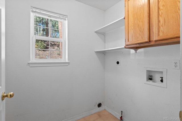 6904 Sprucedale Park Way, Evergreen, CO 80439 - laundry room featuring cabinet space, washer hookup, baseboards, hookup for an electric dryer, and light tile patterned flooring