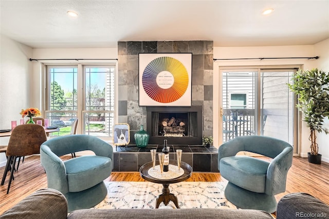 701 Harlan St Unit E59, Lakewood, CO 80214 - interior space featuring baseboards, a fireplace, and wood finished floors